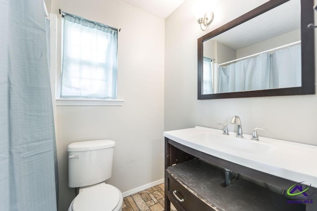 bathroom featuring vanity, toilet, and wood-type flooring