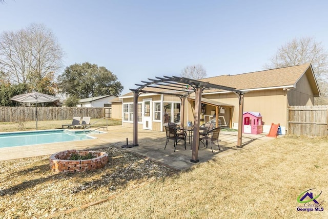 rear view of property featuring a fenced in pool, a pergola, and a patio