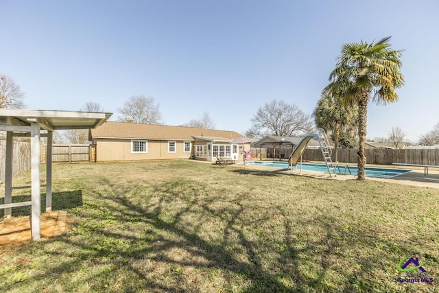 view of yard featuring a fenced in pool