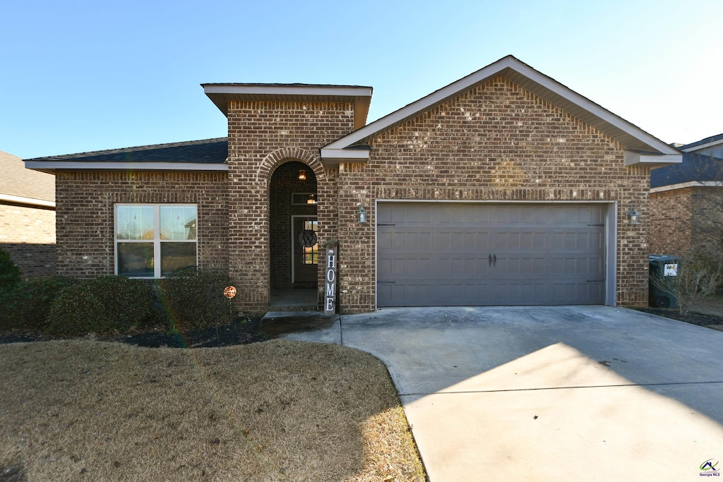 front of property with a garage