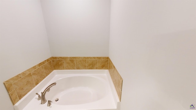 bathroom with a tub to relax in