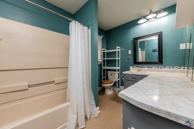 bathroom with shower / bathtub combination with curtain, vanity, and toilet