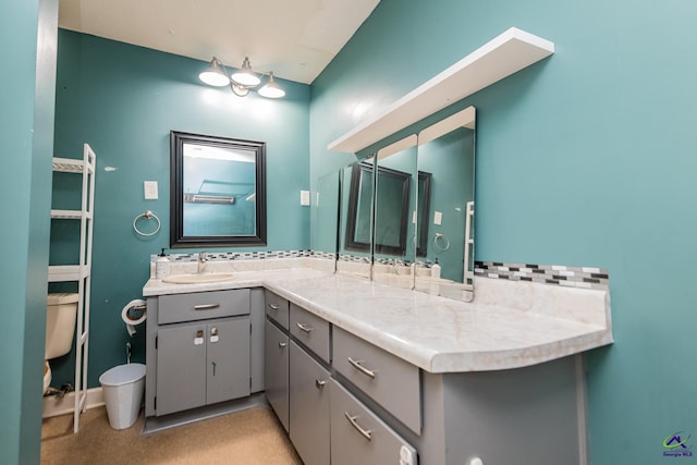 bathroom featuring backsplash and vanity