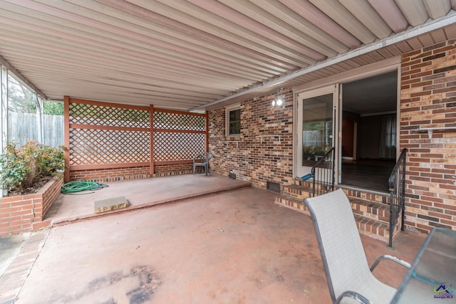 view of patio / terrace featuring fence