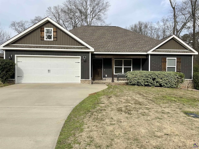 craftsman-style home with a garage and a front yard