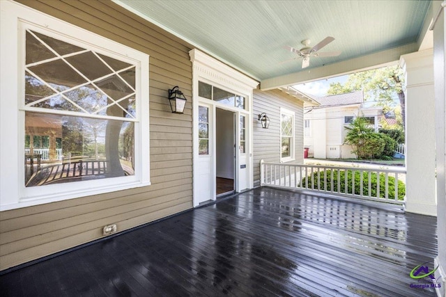 deck featuring ceiling fan and a porch