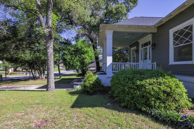 view of yard featuring covered porch