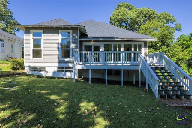 back of house with a lawn and a wooden deck