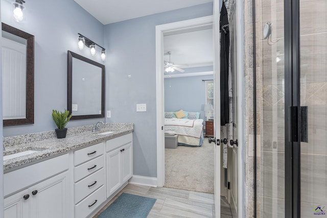 bathroom featuring vanity, walk in shower, and ceiling fan