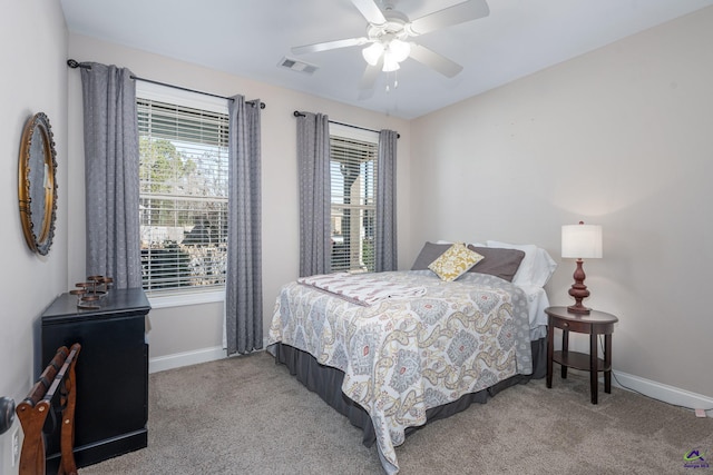 bedroom featuring ceiling fan and light colored carpet