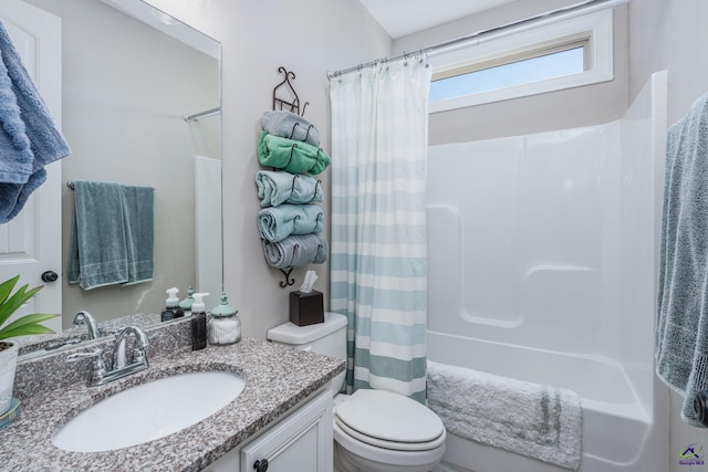 full bathroom featuring toilet, shower / tub combo with curtain, and vanity