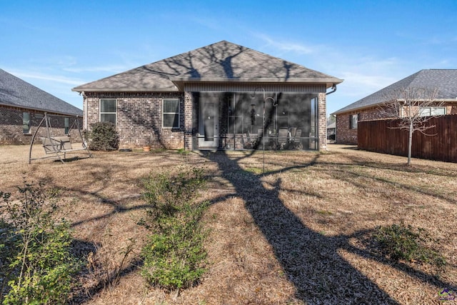 rear view of house with a lawn