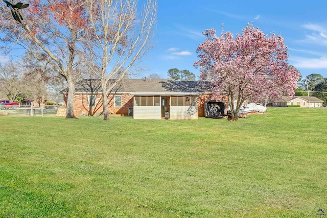 view of yard with a sunroom