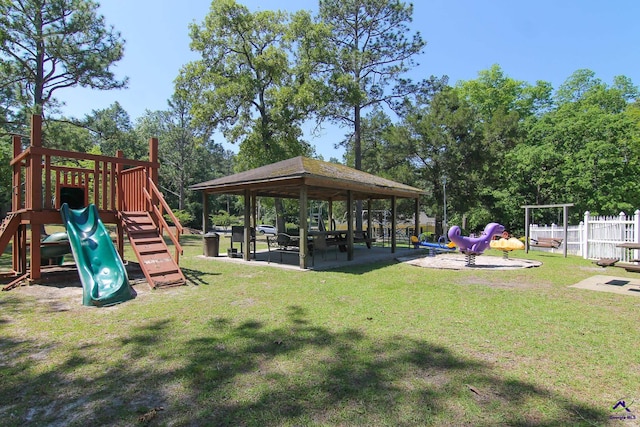 view of playground featuring a lawn and a gazebo