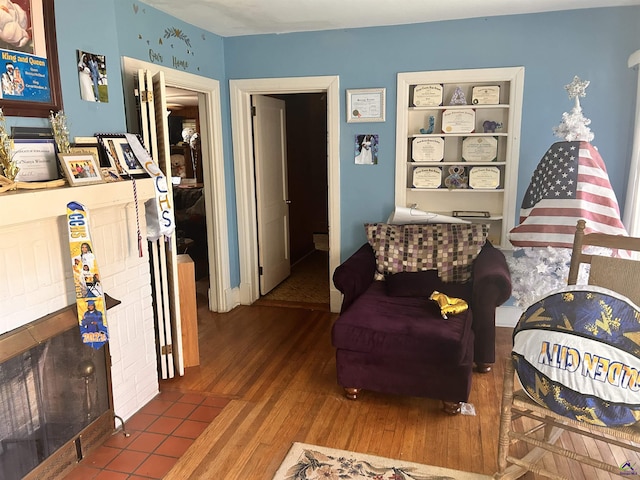 sitting room featuring wood-type flooring