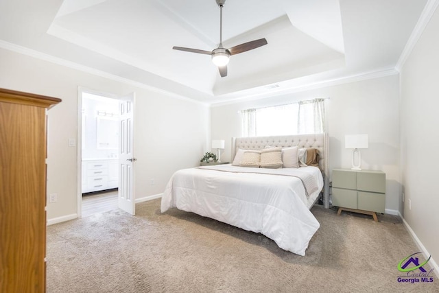 carpeted bedroom with ceiling fan, ornamental molding, and a raised ceiling