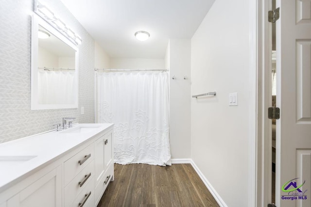 bathroom featuring wood-type flooring and vanity