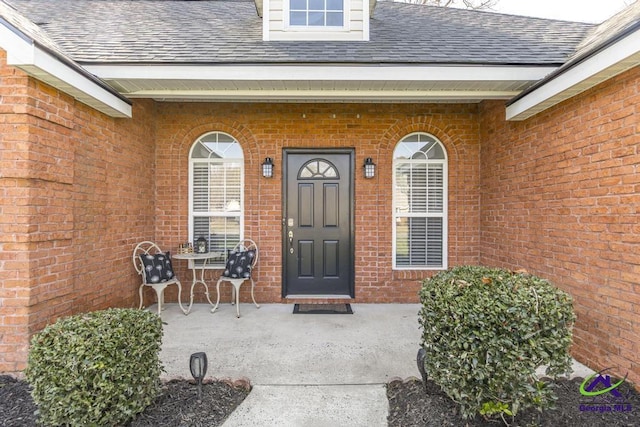 entrance to property with a patio area