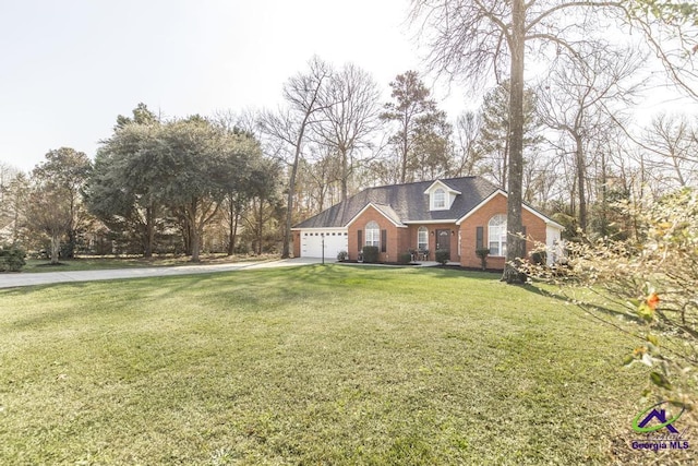 view of front of home featuring a garage and a front lawn