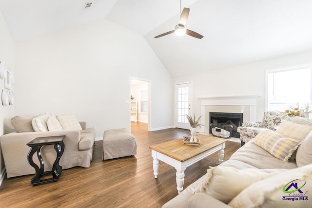 living room featuring ceiling fan, high vaulted ceiling, and wood-type flooring