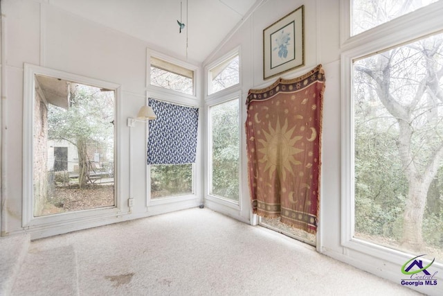 sunroom / solarium with vaulted ceiling