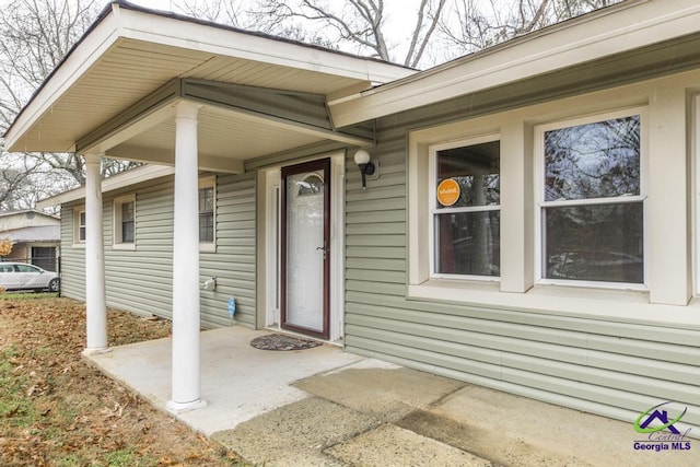 doorway to property with a patio