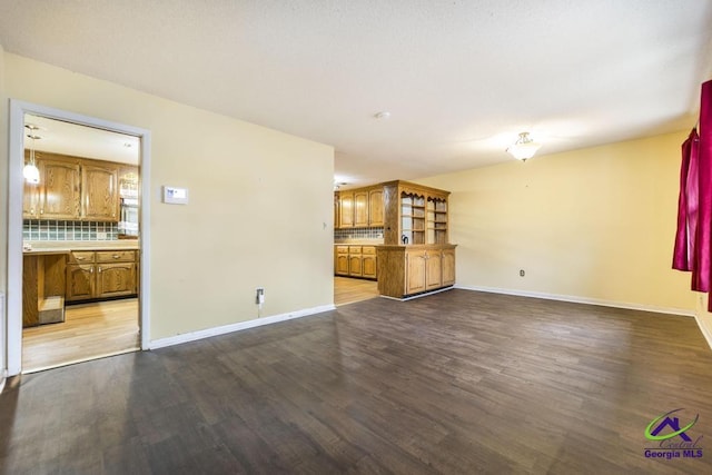 unfurnished living room with hardwood / wood-style floors