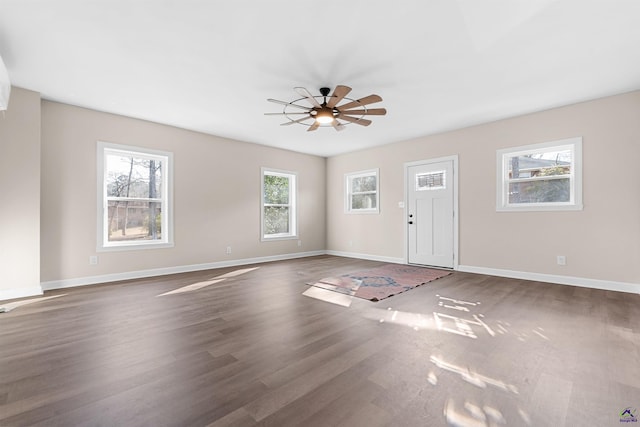 foyer with ceiling fan and dark hardwood / wood-style flooring