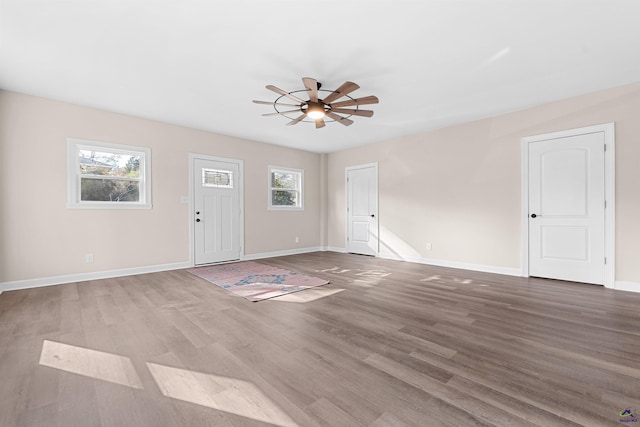 foyer featuring hardwood / wood-style flooring and ceiling fan