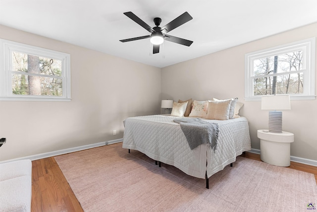 bedroom featuring hardwood / wood-style flooring and ceiling fan