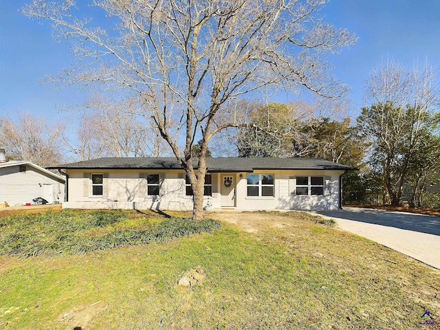 ranch-style house with a front lawn