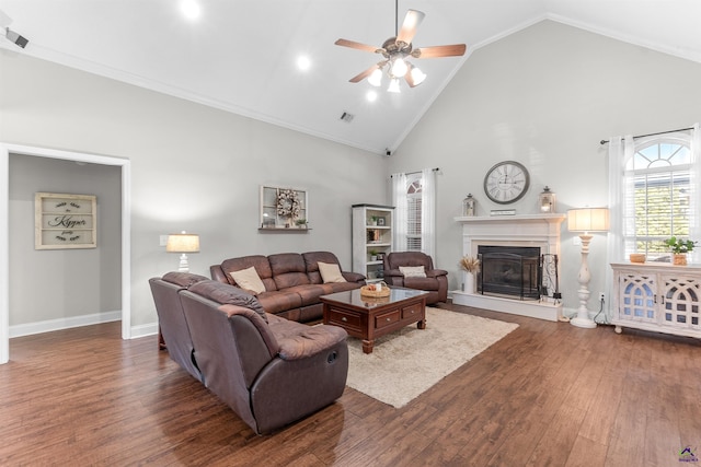 living room featuring dark wood-type flooring, high vaulted ceiling, and ceiling fan