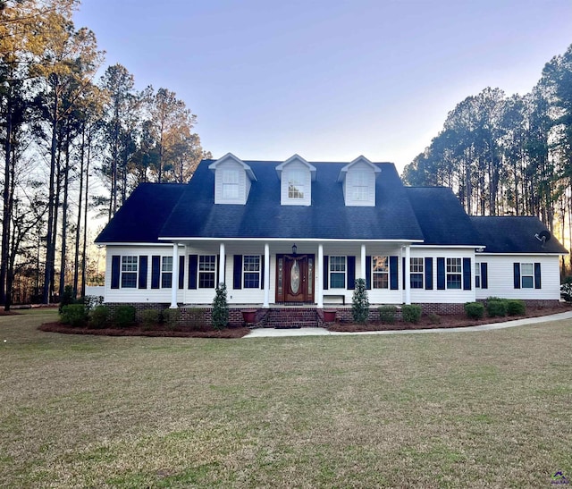 new england style home with a front lawn