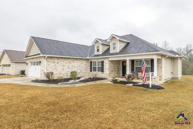 view of front facade with an attached garage, covered porch, concrete driveway, roof with shingles, and a front lawn