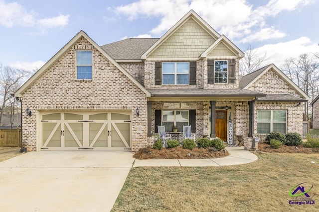 craftsman-style home with concrete driveway, a porch, an attached garage, and brick siding