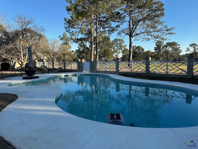 view of swimming pool featuring fence and a fenced in pool