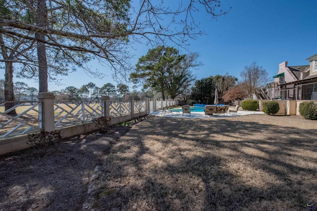 view of yard with a fenced in pool, a patio area, and a fenced backyard