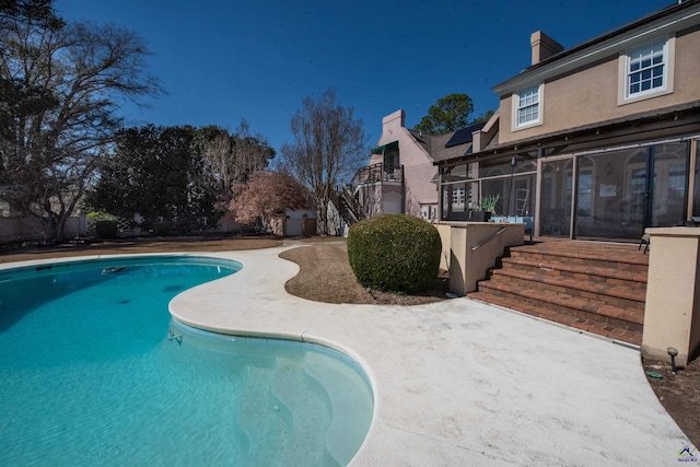 pool with a patio area