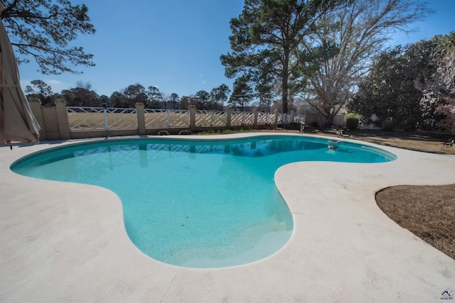 view of swimming pool with fence and a fenced in pool