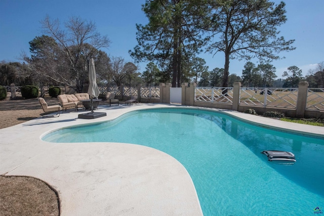 view of pool with a patio, fence, and a fenced in pool