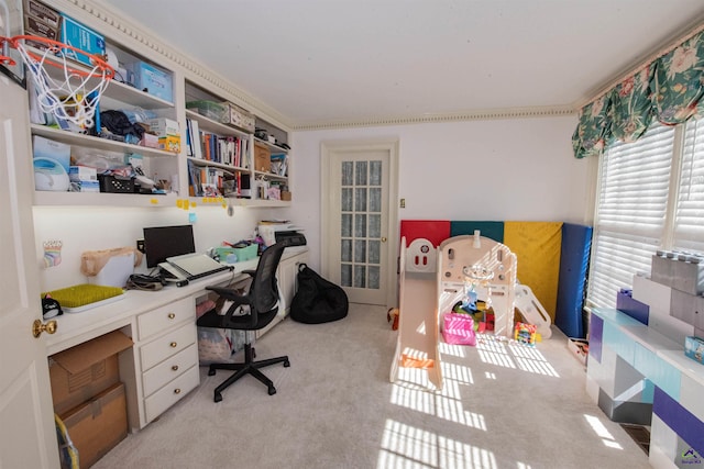 office area featuring light carpet and built in study area