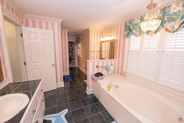 bathroom with a notable chandelier, vanity, a bath, and wallpapered walls