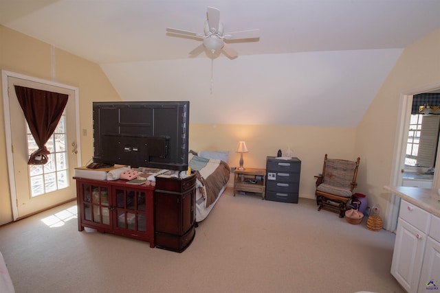 bedroom with access to exterior, multiple windows, vaulted ceiling, and light colored carpet