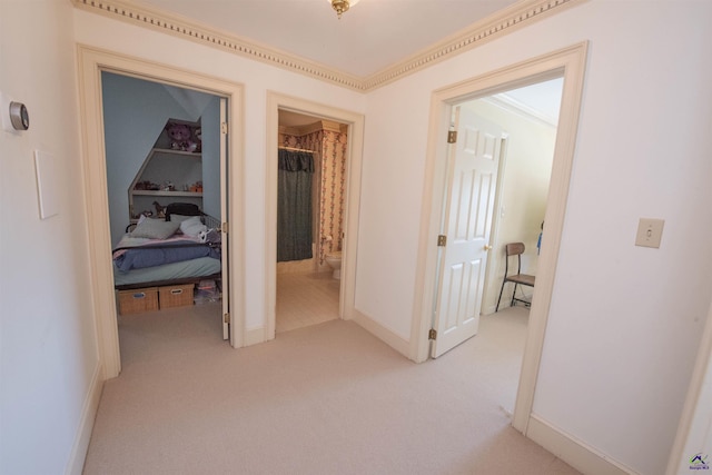 hall featuring light carpet and baseboards