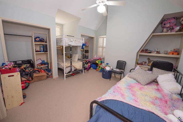 bedroom featuring lofted ceiling, carpet, and a ceiling fan