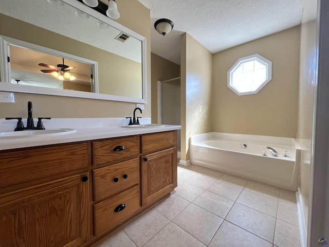 bathroom with double vanity, visible vents, a sink, and tile patterned floors