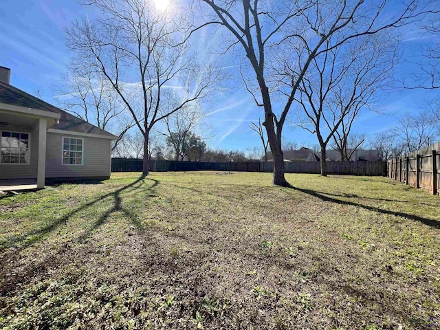 view of yard with a fenced backyard