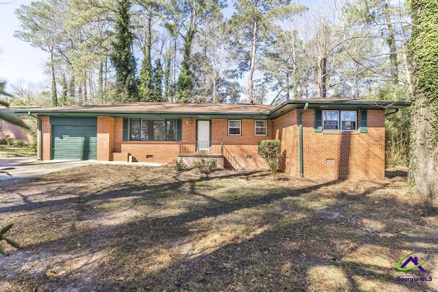 ranch-style home featuring crawl space, driveway, an attached garage, and brick siding