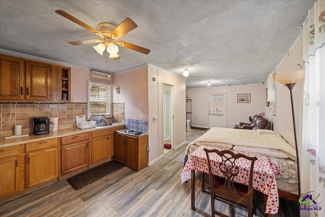 kitchen with light countertops, dark wood-type flooring, and brown cabinetry