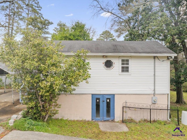 rear view of house with french doors and fence